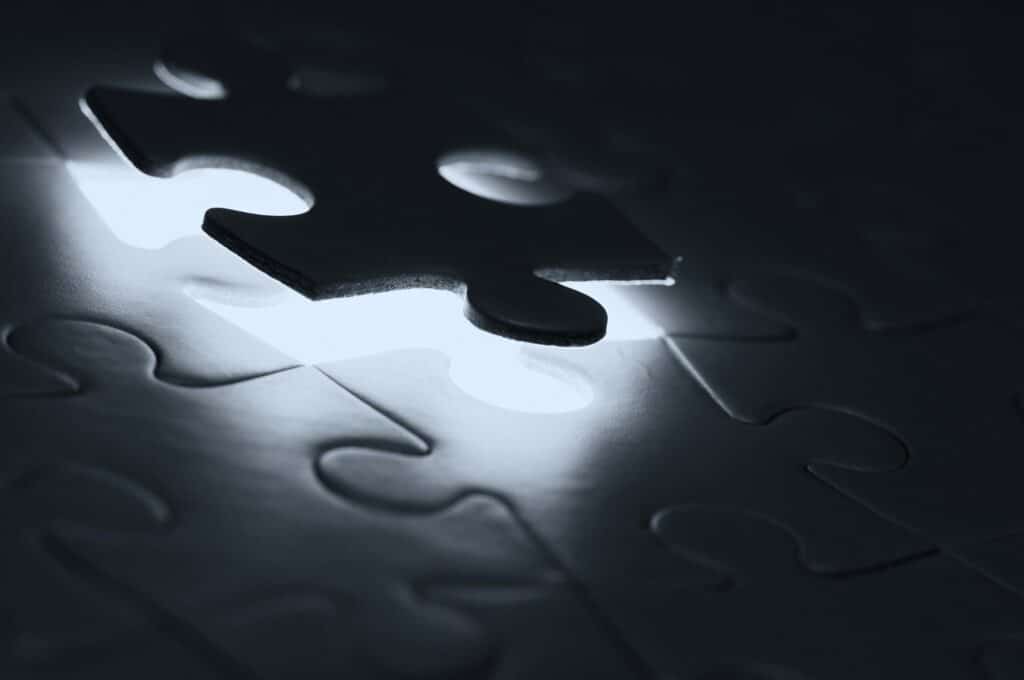 A puzzle with the last piece being placed.